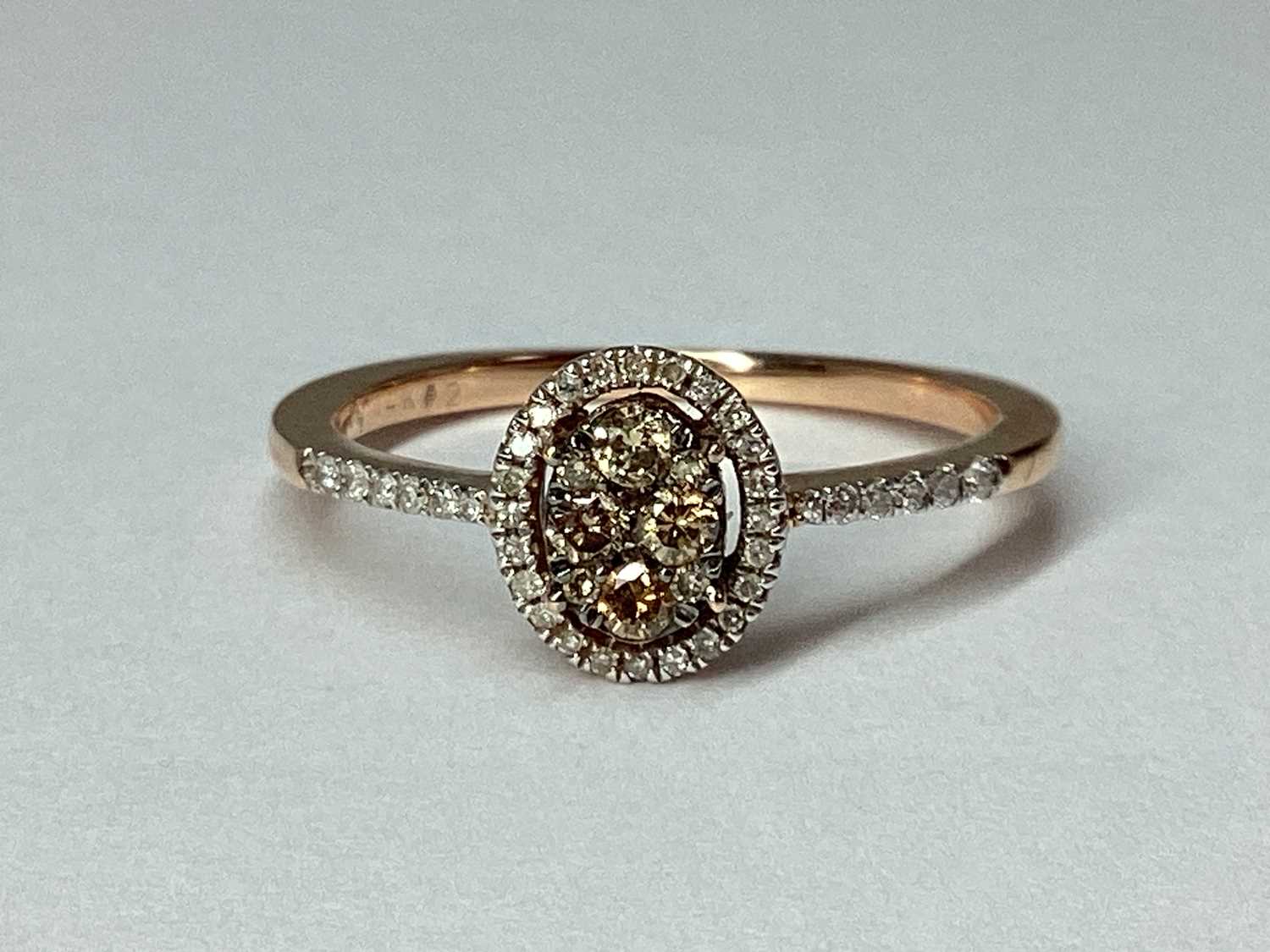 Lot 52 - A Modern Rose Gold Chocolate and White Diamond...