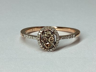 Lot 52 - A Modern Rose Gold Chocolate and White Diamond...