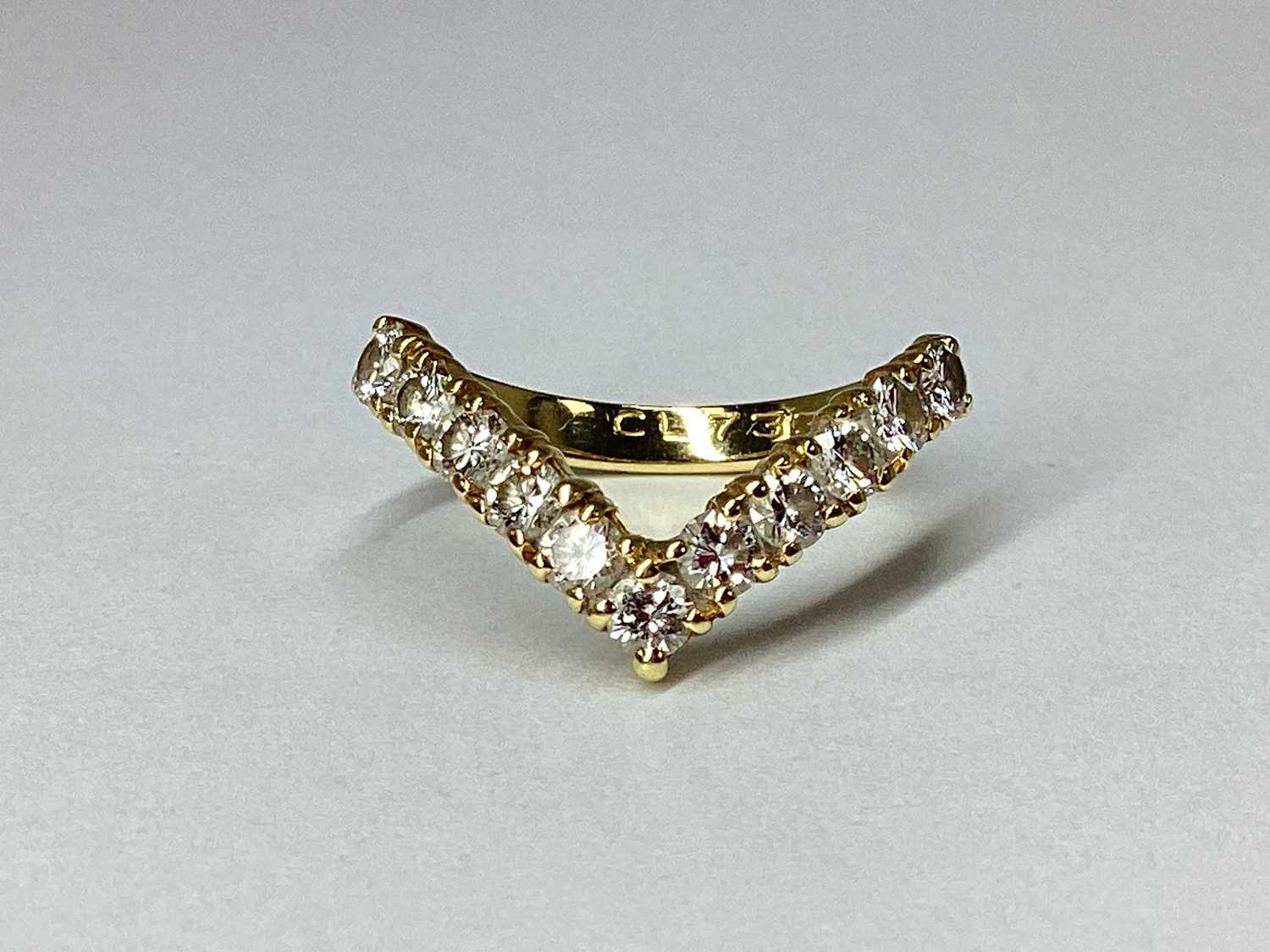 Lot 44 - An 18ct Gold Diamond Set Wishbone Ring, the...