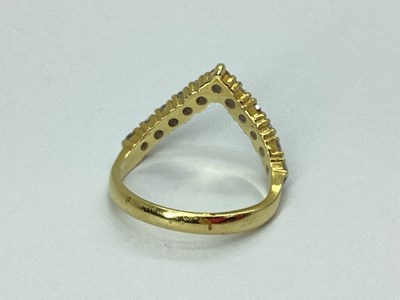 Lot 44 - An 18ct Gold Diamond Set Wishbone Ring, the...