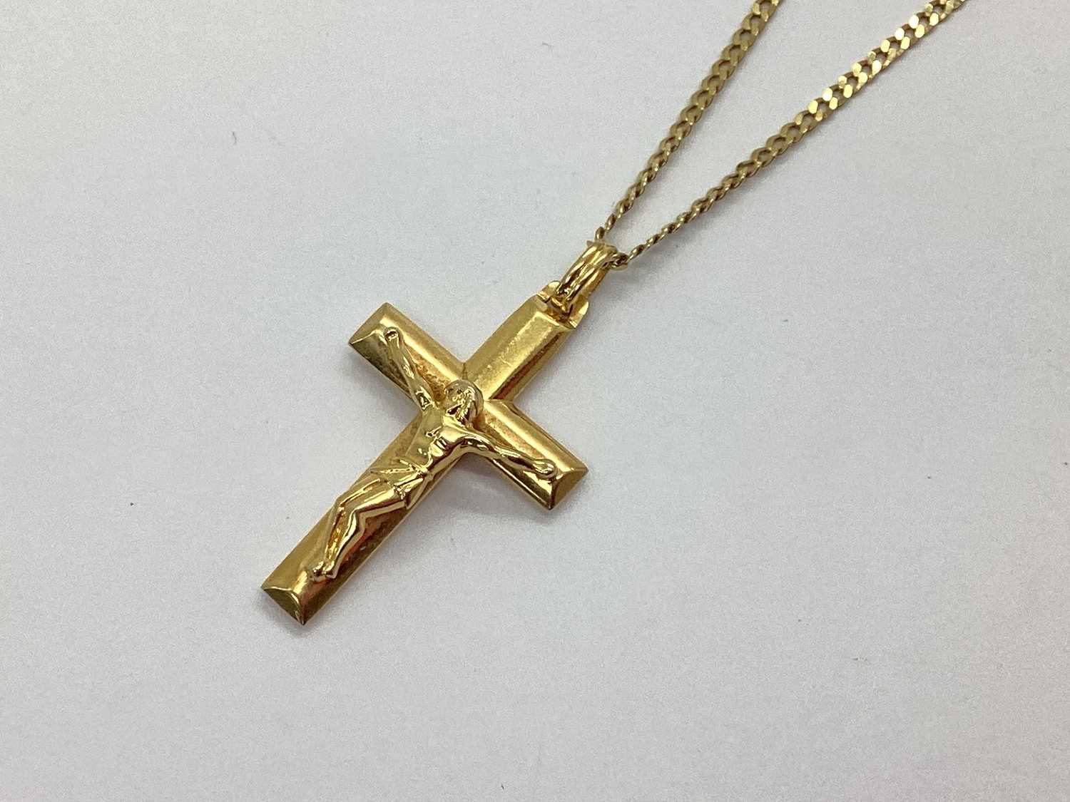Lot 70 - A Modern Crucifix Pendant, stamped "375", on...