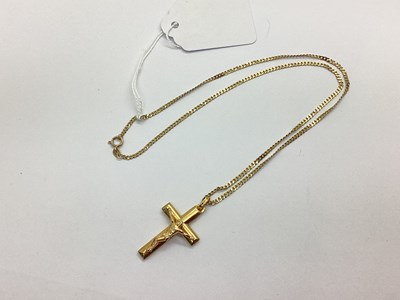Lot 70 - A Modern Crucifix Pendant, stamped "375", on...