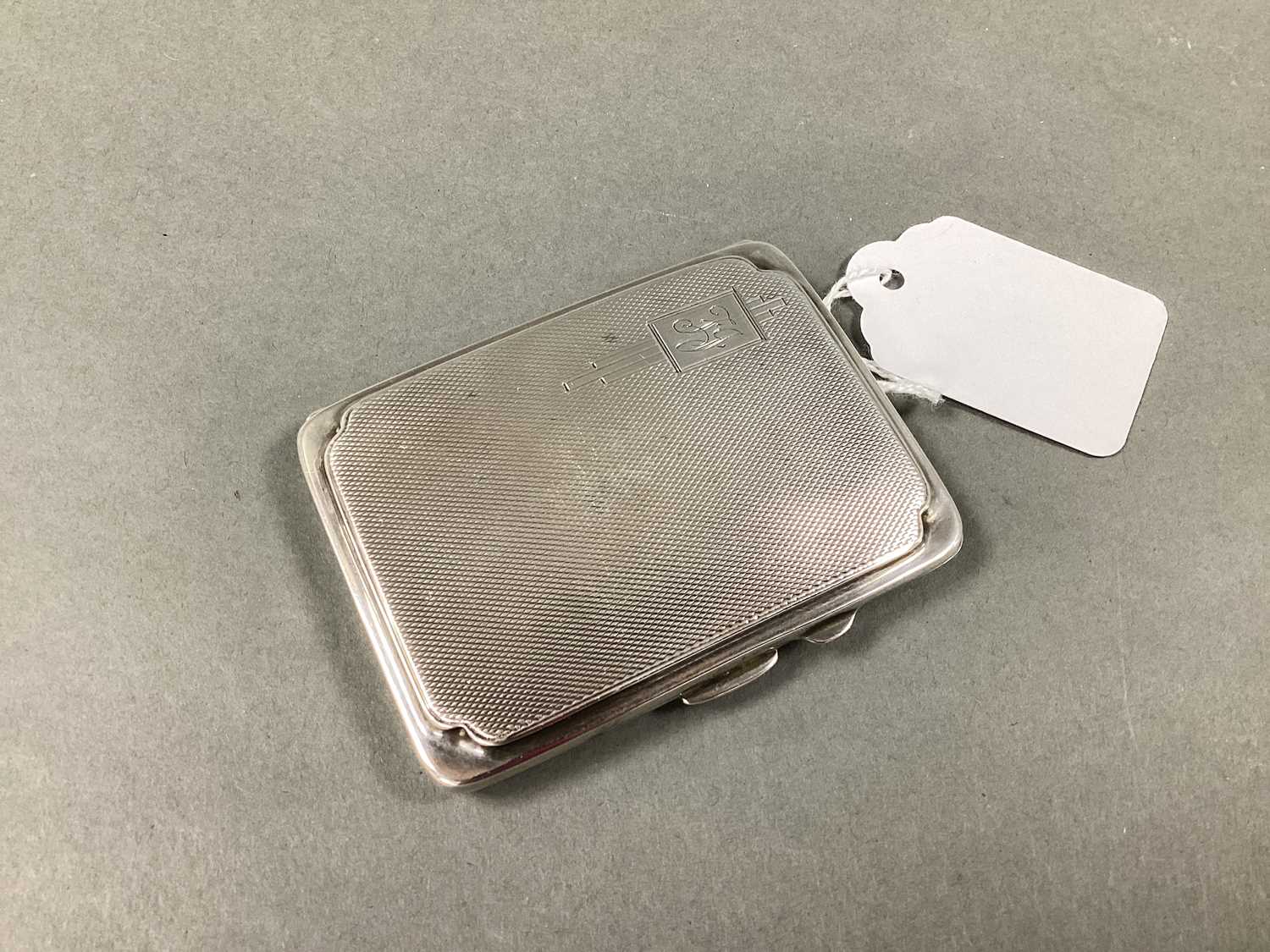 Lot 6 - A Hallmarked Silver Cigarette Case, engine...