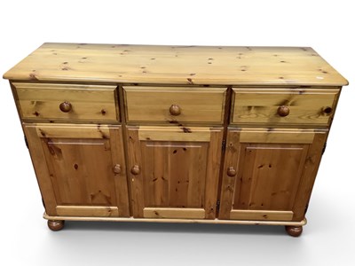 Lot 1547 - Pine Sideboard with three drawers over three...