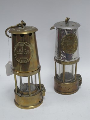 Lot 1376 - Two vintage 20th century miners safety lamps...