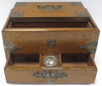 Lot 1299 - An 1890s oak inkstand/writing slope companion,...