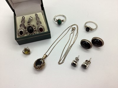 Lot 125 - A Black Oval Inset Locket, of openwork scroll...