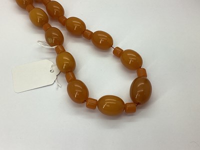 Lot 119 - A Single Strand Amber Coloured Bead Necklace,...