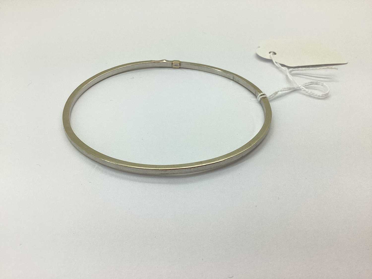 Lot 74 - A Modern Plain Hollow Bangle, stamped "375"...