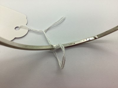 Lot 74 - A Modern Plain Hollow Bangle, stamped "375"...