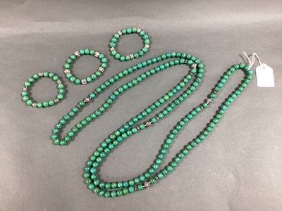 Lot 115 - A Long Single Strand Polished Hardstone Bead...