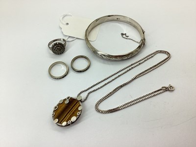 Lot 148 - A Modernist Style Tigers Eye Pendant, the oval...