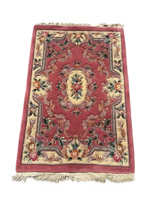 Lot 1504 - A Chinese wool hearth rug, decorated with an...