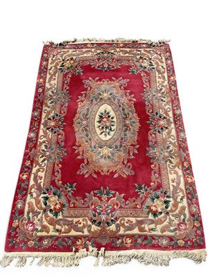 Lot 1480 - A 20th-century Chinese large wool pile carpet,...
