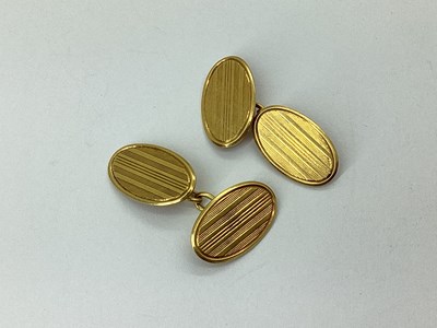Lot 287 - A Pair of 18ct Gold Oval Cufflinks, the engine...