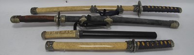 Lot 1289 - Four Reproduction Japanese Short Sword Wall...