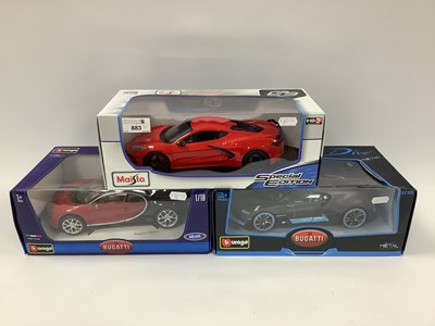 Lot 883 - Three 1:18th scale diecast model sports cars...