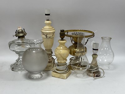 Lot 1403 - Oil Lamps, in brass, glass and alabaster,...