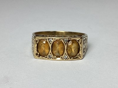 Lot 76 - A 9ct Gold Three Stone Ring, the oval inset...