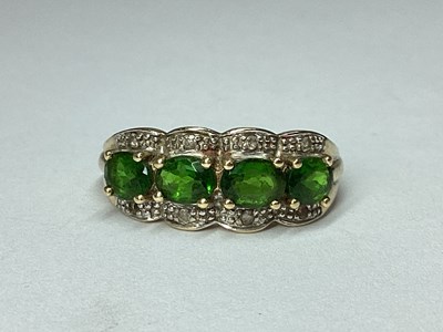 Lot 75 - A 9ct Gold Four Stone Claw Set Ring, the oval...