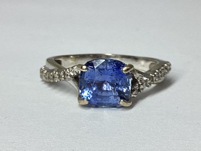 Lot 71 - A Modern Sapphire and Diamond Ring, the...
