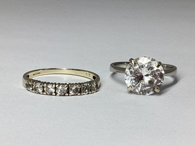 Lot 52 - A 9ct White Gold Half Eternity Ring, claw set...