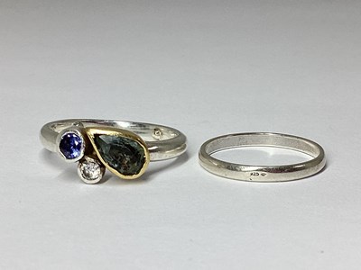 Lot 51 - A Modern Three Stone Collet Set Ring, the...