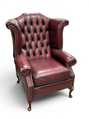 Lot 1504 - Oxblood Red Leather Button-Back Wing Armchair...