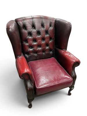 Lot 1506 - Oxblood Red Leather Button-Back Wing Armchair...