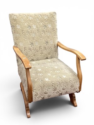 Lot 1429 - Light Wood Rocking Chair Upholstered in an...