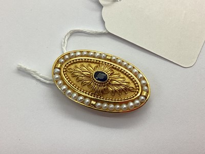 Lot 108 - A Modern Sapphire and Seed Pearl Set Oval...
