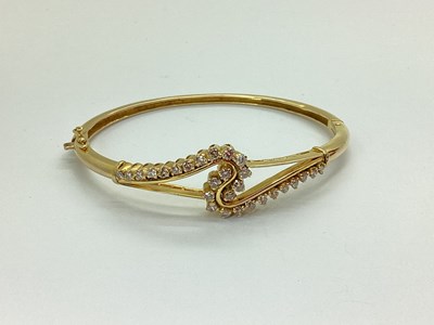 Lot 122 - A Modern Diamond Set Hinged Bangle, graduated...