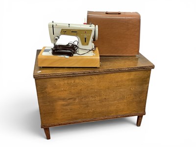 Lot 1458 - Electric Singer Sewing Machine, cased together...