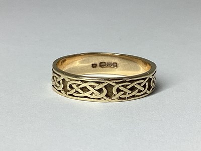 Lot 55 - A 9ct Gold Celtic Style Band, (finger size P).