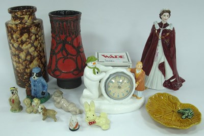 Lot 1161 - Porcelain figures and art pottery, including...