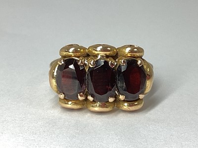 Lot 66 - An Ornate Three Stone Ring, claw set, within...