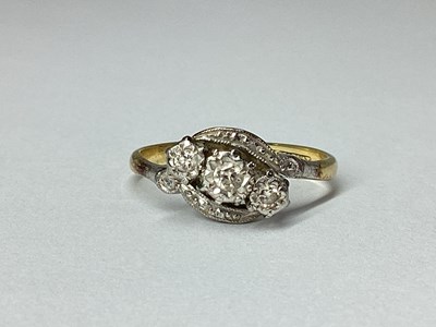 Lot 63 - A Three Stone Diamond Ring, graduated illusion...