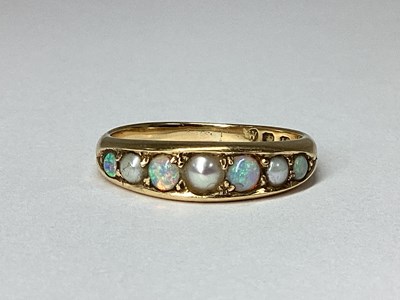 Lot 62 - An 18ct Gold Opal and Seed Pearl Ring,...