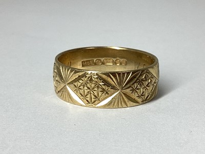 Lot 13 - A 1970's 9ct Gold Patterned Wedding Band,...