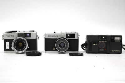 Lot 1056 - Three vintage cameras, comprising an Olympus...