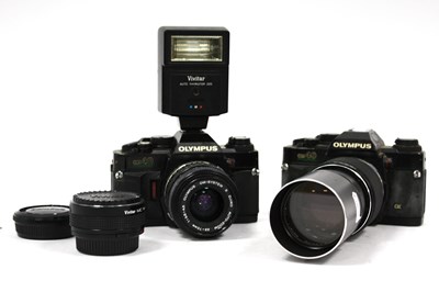 Lot 1059 - Two Olympus OM40 SLR cameras, with E.Zuiko...