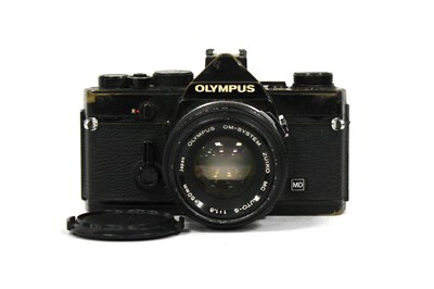 Lot 1057 - Olympus OM-1 black body SLR camera with Zuiko...
