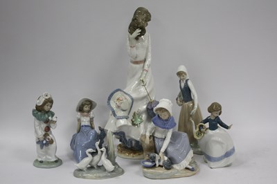 Lot 1301 - Nao Figurines, the tallest, a lady with a...