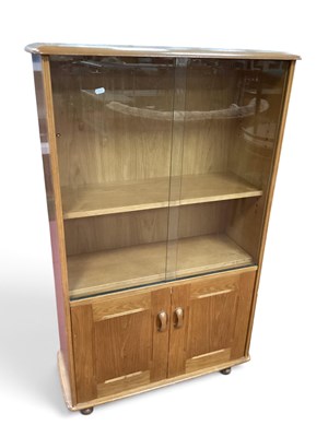Lot 1522 - Priory Mid Century Light Oak Book Cabinet,...