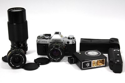 Lot 1032 - Canon AE-1 35mm SLR Film Camera with attached...