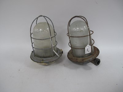 Lot 1461 - A pair of vintage industrial bulkhead lamps,...
