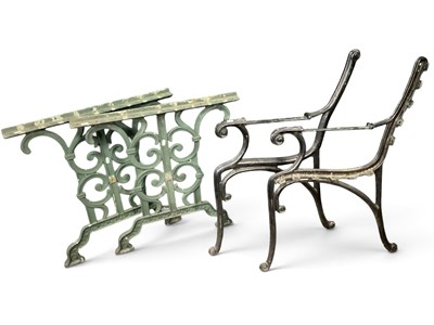 Lot 1558 - A pair of black painted cast iron garden bench...
