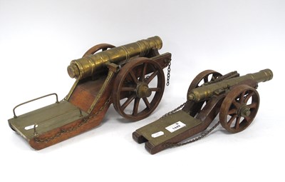Lot 1449 - Two Brass Model Cannons, each on a wooden...