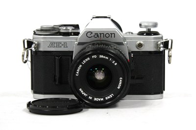 Lot 1021 - Canon AE-1 35mm SLR Film Camera with attached...