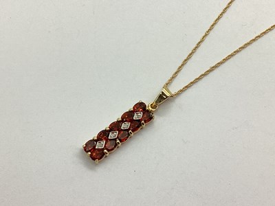 Lot 105 - A 9ct Gold Claw Set Bar Pendant, the oval cut...